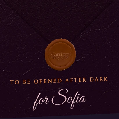 The copper wax seal on the plum envelope